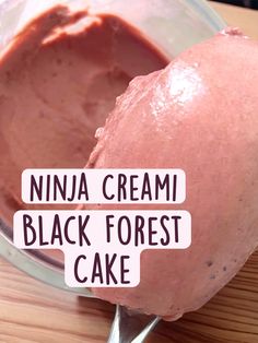 a scoop of ice cream in a bowl with the words ninja cream black forest cake on it