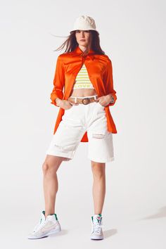 Add a touch of sophistication to your wardrobe with this Satin Shirt with Split Cuff in Orange. Made from a luxurious blend of 55% rayon, 43% viscose, and 3% spandex, this full-length shirt offers a relaxed and oversized fit, perfect for any classic occasion. The wide collar neckline and long sleeves create an elegant silhouette, while the satin fabric ensures a polished look. Designed to run true to size, our model, with measurements 33-24-35 and height 5'8", is wearing a size S. This stylish s Orange Satin, Blouse Neck, Elegant Blouses, Classic Wardrobe, Statement Shirt, Satin Shirt, Party Fashion, Relaxed Style, Easy Wear