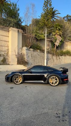 a black sports car parked on the street