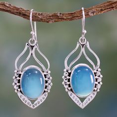 Dewdrops the color of the sky bathe mystical leaves in an elegant design from India's Shanker. The earrings are crafted by hand of sterling silver and chalcedony dyed blue. .925 Sterling silver Boho Blue, Flower Ear, Wedding Party Jewelry, Pretty Jewelry, Moonstone Earrings, Sterling Silver Dangle Earrings, Shiny Things, Snow Jacket, Blue Chalcedony