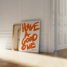 an orange and white sign that says have a good one next to it on the floor