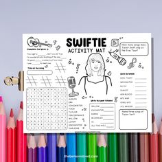 an activity mat with pencils and crayons next to it that says swiffie