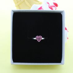 A cute sparkly sterling silver ring with a little pink cubic zircon heart. The cute sterling silver ring would be a perfect gift. The ring can be adjusted to different sizes. Each piece arrives in a beautiful White gift box with a contrasting silver logo. A free gift wrapping service is also available upon request. Pink Rings For Valentine's Day Proposal, Pink Heart Ring For Valentine's Day Proposal, Silver Heart-shaped Birthstone Ring Gift, Mother's Day Gift Cubic Zirconia Heart Ring, Mother's Day Gift Heart Ring With Cubic Zirconia, Cubic Zirconia Heart Ring For Mother's Day Gift, Valentine's Day Pink Sterling Silver Birthstone Ring, Sterling Silver Heart Ring For Valentine's Day Proposal, Pink Heart Cut Rings For Gift