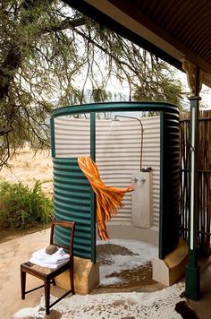 an outdoor shower in the middle of winter