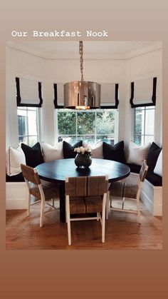 a dining room table with chairs and a bench in front of a window that reads, home is now our breakfast nook send message