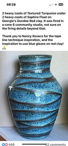 a large blue vase sitting on top of a white table next to a wall with an instagram message