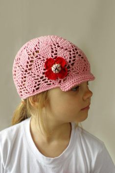 Stylish lace kids summer visor hat or cap is crocheted from beautiful pink  100% cotton yarn. This is a great hat for spring and summer, protecting your toddler head for sun. Girls sun hat is decorated with red crocheted poppy flower.Size: kids, toddlers (ages 2 - 6)Hight: 15 cm( about 6")Head circumference 20-20,5" (around 50-52 cm)Little bit strchy.Care: Hand wash in cool water. Lay flat to dry. Reshape while damp. No dryer!Ready to ship. Cute Adjustable Brimmed Crochet Hat, Adjustable Pink Cotton Crochet Hat, Cute Cotton Crochet Hat For The Beach, Cute Summer Crochet Beanie Hat, Adjustable Pink Crochet Hat As Gift, Pink Yarn Crochet Hat For Gift, Pink Crochet Hat As A Gift, Cute Handmade Adjustable Sun Hat, Handmade Pink Sun Hat, One Size