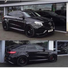 two black cars are parked in front of a dealership and one is being sold