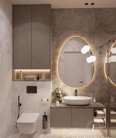 a bathroom with two round mirrors on the wall and a sink in front of it