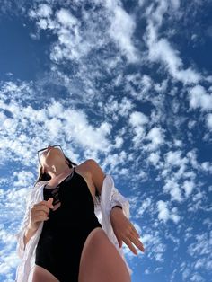 a woman in a bathing suit flying through the air