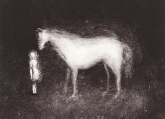 a man standing next to a white horse in the dark night with it's head down