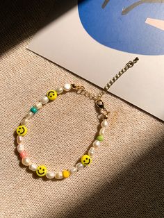 Handmade jewelry handmade beadwork pearls bracelet pearls jewelry classic fun style smiley jewelry rainbow pearls wearable art handmade in singapore Smiley Jewelry, Bracelet Pearls, Pearls Bracelet, Jewelry Classic, Pearls Jewelry, Fancy Jewellery Designs, Bracelet Pearl