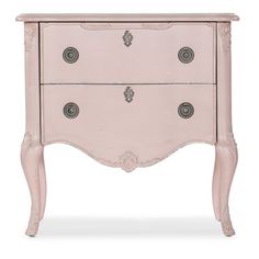 an antique pink dresser with ornate carvings on the top and bottom drawers, painted in white