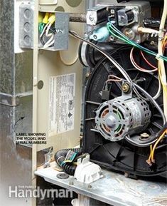 the inside of an electric box with wires and other electrical equipment attached to it's side