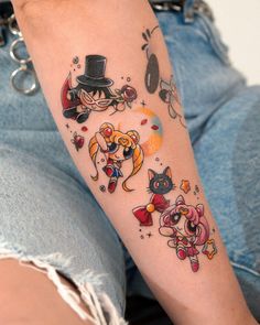 a person with a cat tattoo on their arm and the other one is wearing a top hat