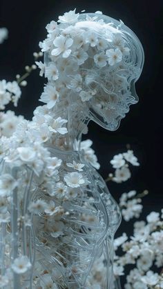 a white sculpture with flowers in it's body