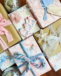 presents wrapped in pink, blue and gold paper