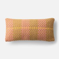 a yellow and pink pillow with squares on it