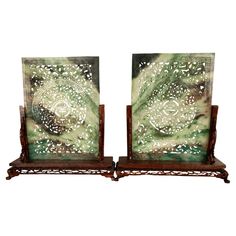 pair of art deco bookends with green and white designs on wood bases, circa 1950's