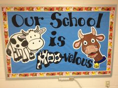 a sign that says our school is moo - velous on the wall