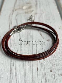 "Introducing the 'Rustic Wrap' Multistrand Leather Bracelet - a true embodiment of classic craftsmanship and natural style. This bracelet features multiple strands of supple brown leather, carefully designed to wrap comfortably around your wrist, creating a layered look that's both stylish and substantial. Secured with a sturdy clasp, it's adjustable to ensure the perfect fit for any wrist size. Whether it's a casual day out or an evening event, this wrap bracelet is the ideal accessory to bring Brown Leather Wrap Bracelet As Gift, Brown Leather Strap Bracelet, Brown Leather Wrap Bracelet Gift, Brown Leather Wrap Bracelet For Gift, Brown Leather Strap Wrap Bracelet Gift, Brown Leather Strap Braided Bracelet Gift, Minimalist Brown Bracelet With Leather Strap, Minimalist Brown Bracelets With Leather Strap, Brown Double Band Jewelry With Leather Strap