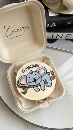 a cookie in a box with a koala on it