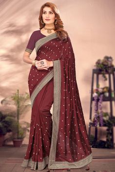 Dazzle everyone around as you walk into a wedding wearing this burgundy maroon silk saree which will surely grab everyone's attention.This sweetheart neckline and half sleeve blouse is designed using zari work.It is available with a silk lightweight saree in burgundy maroon color elaborated using zari work.This saree blouse can be customized up to the maximum size available in inches 58 around the bust. Slight color variation may occur due to photographic reasons. Maroon Silk Saree, Saree For Wedding, Embroidered Saree, Half Sleeve Blouse, Zari Work, Maroon Color, Wedding Wear, Saree Wedding, Saree Blouse