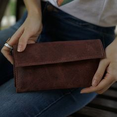 With so many ladies' wallets on the market, it's difficult to decide which one best fits your needs. We are here to help and believe we have some great options to consider. Our Handmade Brown Women’s Wallet is a comfortable way to carry your necessities. There are two bill compartments, 12 storage slots for cards and two open space compartments. The interior zipper pocket is perfect for those small items and loose change. Everything closes easily with a magnetic closure. Beyond its great appeara Women’s Wallet, Leather Change Purse, Leather Camera Strap, Womens Wallet, Loose Change, Brown Leather Wallet, Handmade Leather Wallet, Personalized Wallet, Leather Coin Purse