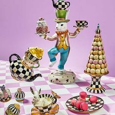 an assortment of figurines on a checkered table