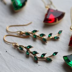 These Beautiful Earrings Feature A Curved Branch Shape With Tiny Emerald Jewelled Leaves Here And There. The Earrings Measure 50mm (Two Inches) Long And Are Light And Comfortable To Wear. When Worn, These Earrings Are Designed To Hang Around The Jawline. The Gold Metal On The Earrings Is Gold Plated Brass. New - Never Worn