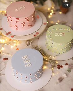 three birthday cakes on plates with confetti around the edges and numbers on them