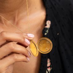 The Story A striking antique piece from the Victorian era. Created in 14 karat yellow gold, a raised mythical lion's head is the main feature of this round locket. Formed with lots of expression, two small rubies are set as the eyes with a 0.10 carat Old Mine Cut diamond set within the lion's mouth. The locket shows its age in the best possible way with the rich patina making the raised work pop and gold glow. At 1.66" tall with its bale, it's a substantial size. It holds two round photos and is Gold Medallion Locket Necklace Stamped 14k, Victorian Round Locket Necklace Stamped 14k, Timeless Antique Gold Medallion Jewelry, Victorian Yellow Gold Round Pendant Locket Necklace, Victorian 14k Stamped Round Locket Necklace, Yellow Gold Coin-shaped Jewelry With Polished Finish, Antique Gold-plated Round Necklace, Polished Yellow Gold Coin Jewelry, Yellow Gold 14k Stamped Pendant Locket Necklace