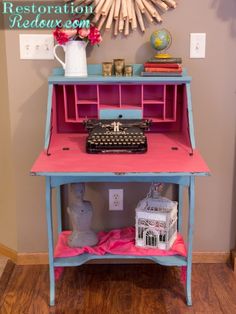 a desk with a typewriter on it