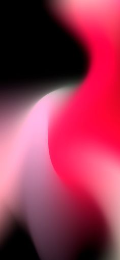 a blurry image of pink and white shapes