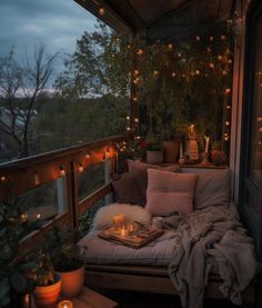 a balcony with lights and pillows on it