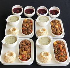 six plates with different types of food on them and sauces in small bowls next to each other