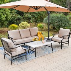 patio furniture set with an umbrella over it