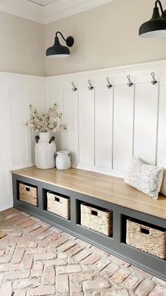 a bench with baskets on it in a room