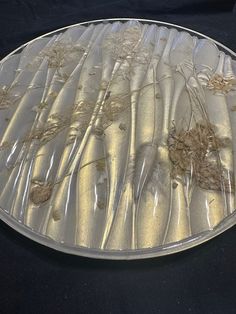 a plate that has some kind of flower design on it, sitting on a table