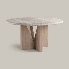 a white marble table with two wooden legs and a circular top, on a gray background