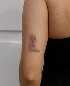 a woman with a tattoo on her arm