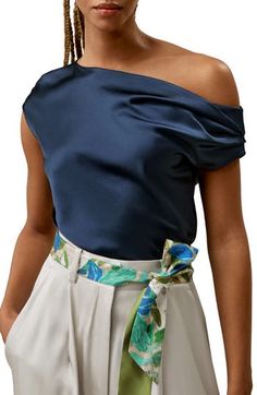 The cowl neck detailing, short flutter sleeves, and loop fastenings to the nape add an extra exquisite drape and feel. Perfect for both work and vacation, this top allows you to feel stylish and confident for any occasion. 100% Charmeuse Silk Regular fit Cowl neck, sleeveless One-shoulder top Summer Silk Draped Top, Blue Off-shoulder Evening Tops, Summer Boat Neck Blouse, Off-shoulder Tops For Formal Summer Events, Off-shoulder Tops For Summer Formal Events, Silk Tops For Women, Silk Tops, One Shoulder Tops, Flutter Sleeves