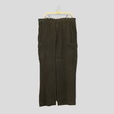 "Size 38x31 Banana Republic Cargo Pants Baggy Pants Multi Pocket Workers Pants Brown Pants Zipper Pants Baggy Loose Pants W38 Please contact me for any questions about this clothing before buying. SIZE MEASUREMENTS :- WAIST : 38\" inches HIPS : 48\" inches THIGH: 30\" inches LEG OPENING : 20\" inches RISE : 13\" inches INSEAM : 31\" inches OUTSEAM (TOTAL LENGTH) : 43\" inches WEIGHT : 0.88 kg Condition : Good Condition. Has tiny stain please refer a picture. Please pay close attention to measure Military Style Wide Leg Work Pants With Pockets, Military Wide Leg Work Pants With Pockets, Military Trousers With Hip Pockets, Military Style Full Length Bottoms With Patch Pockets, Military Style Full-length Bottoms With Patch Pockets, Green Chinos With Pockets, Green Full-length Chinos With Pockets, Green Full Length Chinos With Pockets, Vintage Baggy Full-length Cargo Pants