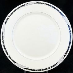 a white plate with black and silver designs on it