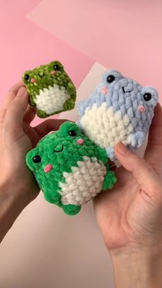 three small crocheted animals are held in their hands