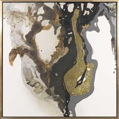 an abstract painting with gold, black and white paint on it's surface in a frame