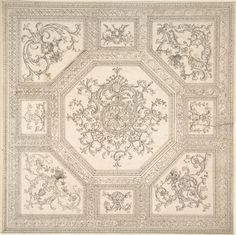 an intricately designed rug with many different designs on the top and bottom, all in white