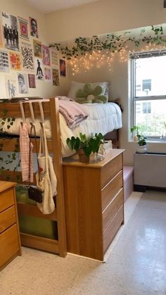 a bedroom with a bunk bed and lots of plants on the wall next to it