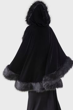 DARK AURA.- Soft velvet with faux fur trims.- Statement cloak.- Uneven hem.- Front tie with moon hardware.- Oversized hood.- Fully lined.- Relaxed fit.With KILLSTAR branding, Shell fabric : 95% Polyester 5% Elastane, Lining: 100% Polyester, Trim : 59% Acrylic 41% Polyester.Do no wash / Do not bleach / Do not tumble dry / Do not iron / Do not dry clean. Imported. Victorian Cloak, Dark Aura, Black Cloak, Victorian Gothic, Cloak, Soft Velvet, Fur Trim, Aura, Faux Fur