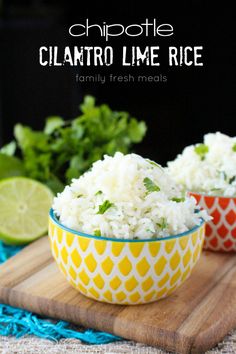 two bowls filled with white rice and garnished with cilantro limes